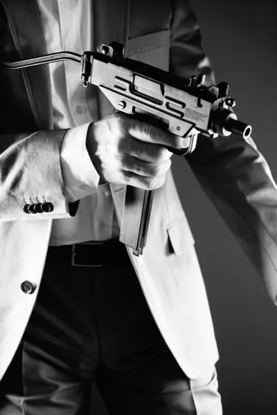 Retro secret agent with porstol revolver gun in hand in vintage crime thriller mockup cover     photo.