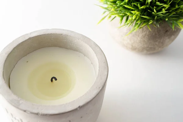 stock image Stone candle holder and fake grass potted plant