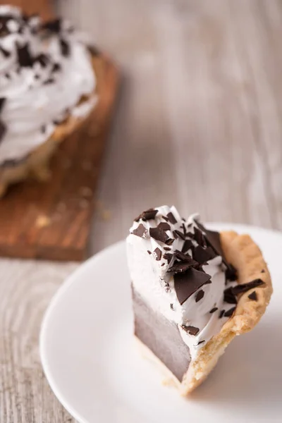 A mini chocolate cream pie slice