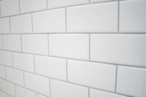 White subway tile with gray grout