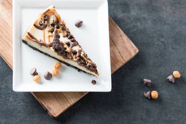 stock image A slice of chocolate and butterscotch swirl cheesecake 