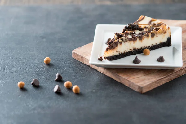 stock image A slice of chocolate and butterscotch swirl cheesecake 