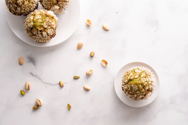 Homemade pistachio muffins with sugar crystals