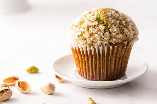 Homemade pistachio muffins with sugar crystals