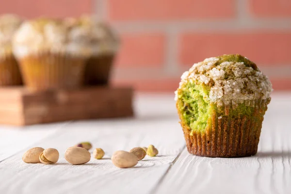 Homemade pistachio muffins with sugar crystals