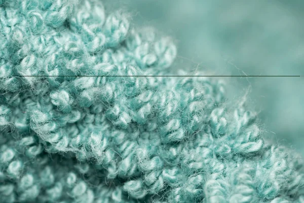 turquoise colored towel fabric macro abstract close up.