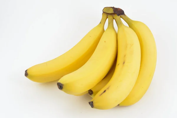 一堆白色背景的黄色香蕉 — 图库照片