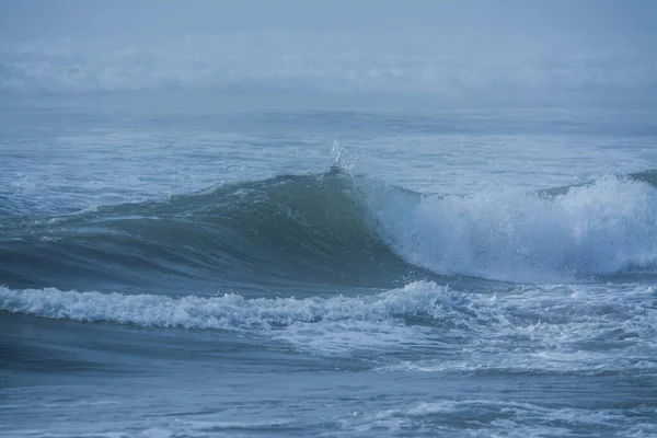 Massive waves crashing in ocean