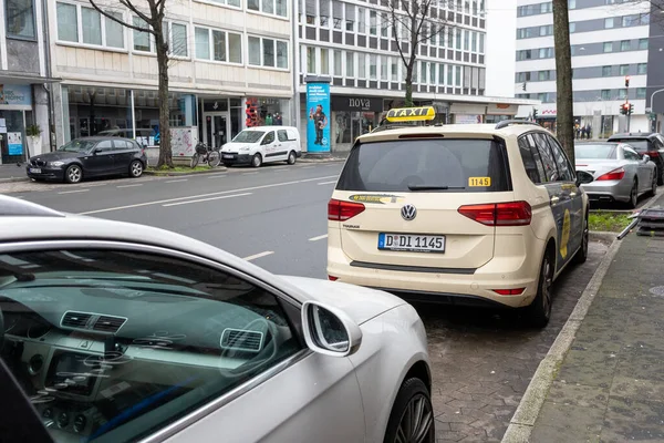 stock image Dusseldorf, Germany - January 22, 2023: German Taxi parked on the side of the road. Germany Taxis are marked with a yellow black taxi sign on the vehicle