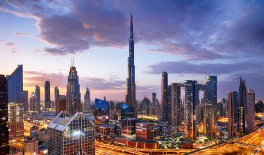 Burj Khalifa skyline in Dubai at dramatic sunset - aerial view, United Arab Emirates