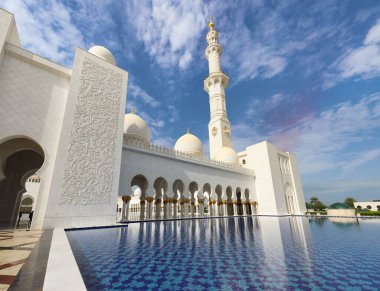 Sheikh Zayed Mosque in Abu Dhabi, UAE, at day with reflection in the water