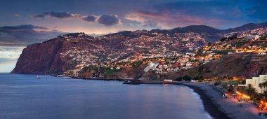 Funchal city at night near Praia Formosa beach, Madeira - Portugal clipart