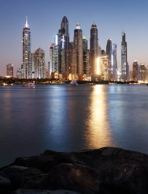 Panorama of Dubai Marina at night with scyscrapers skyline, UAE