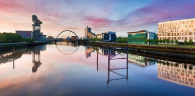 Glasgow panorama at dramatic sunrise with Clyde river, Scotland