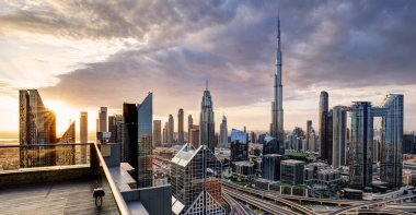 Dubai, UAE, January 11 2023: Dramatic sunrise over Dubai skyline panorama with Burj Khalifa and luxury skyscrapers, United Arab Emirates clipart