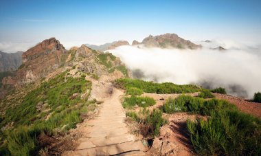 Arieiro peak, mountain landscape over clouds, Madeira clipart