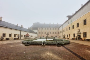 Castle of Cerveny Kamen in Slovakia at mist clipart