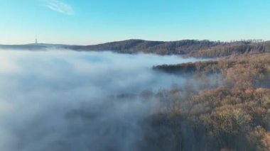 View over clouds of the radio tower Kamzik in Bratislava, Slovakia