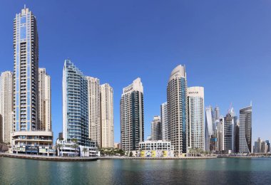 Dubai, UAE, January 11 2023: Luxury Dubai Marina canal and promenade in beautiful summer day,Dubai,United Arab Emirates