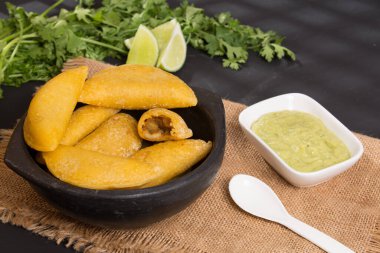 Colombian empanada - on the black background.traditional colombian food..