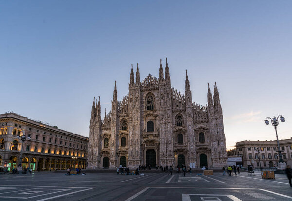 MILAN, ITALY - October 07, 2017 :  Duomo di Milan , the most famous gothic white marble cathedral church of Milan, in the morning, Italy