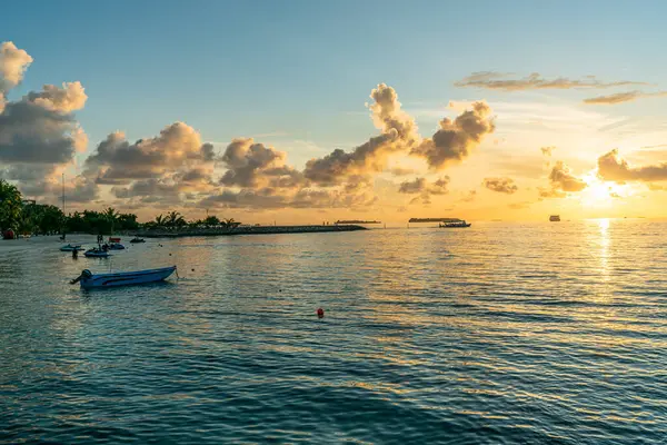 Golden sunset in bikini beach, Maafushi island, Maldives
