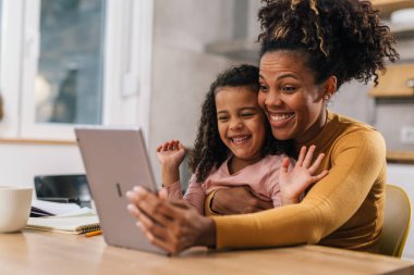 Mother and daughter use video call to communicate