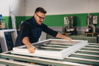 Handyman works in a PVC industry