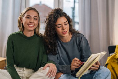Front view of a two college student preparing for the exam