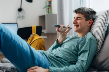 High school student is having an enjoyable phone call