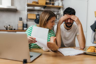 Young Caucasian couple has problems with debt