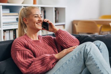 Happy woman is having a phone call with her boyfriend