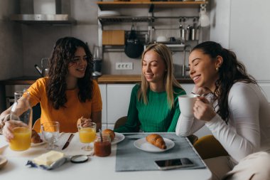 Friends are having coffee and pastry over a nice conversation