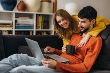 Happy Caucasian couple is enjoying the day in the house