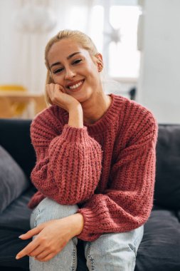 Beautiful blond woman looks at the camera