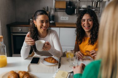 Friends have fun time over breakfast