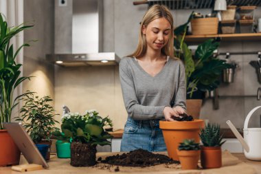 Front view of a florist working with plants