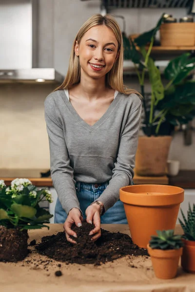 Front view of a young female florist looking at the camera