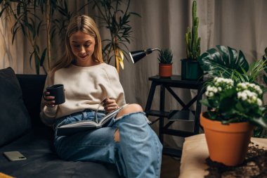 Florist is taking a break and reading a book