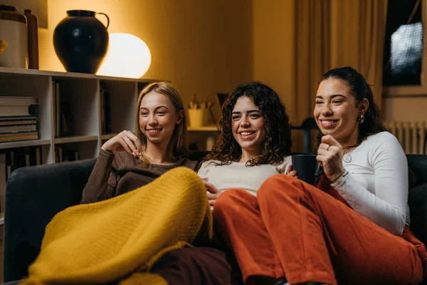 stock image Three close friends watch a movie together
