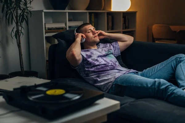 Caucasian Man Puts Headphones Listen Records Relax Night — Stock Photo, Image