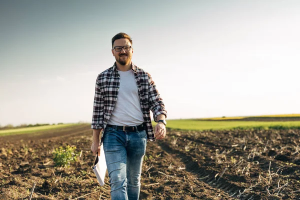 stock image A happy man is walking in the field on a sunny day.