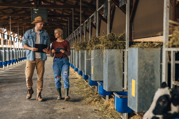 Inspectors walking trough animal nursery.