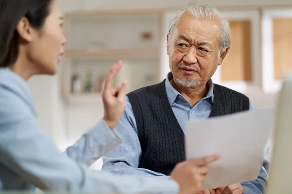 Senior Asian Man Appears Confused Suspicious Sales Person Selling Financial — Fotografia de Stock
