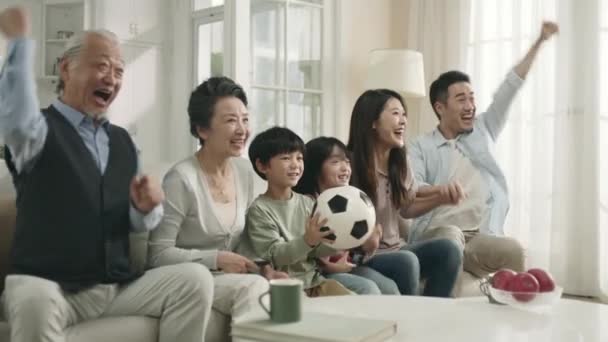 Three Generation Asian Family Sitting Couch Home Watching Live Broadcasting — Stock video