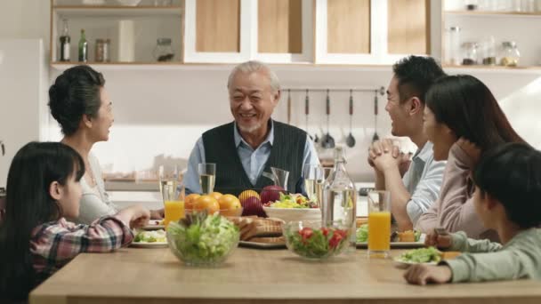 Three Generation Asian Family Sitting Dining Table Having Pleasant Conversation — Stock video