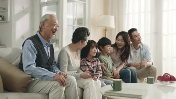 Three Generation Asian Family Sitting Couch Watching Together Home — Stockvideo