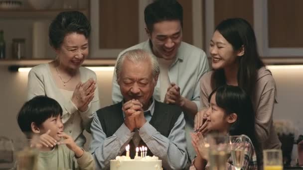 Three Generation Asian Family Celebrating Grandpa Birthday Home Cake Candle — Stock video