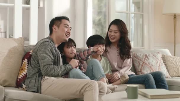Happy Asian Family Sitting Couch Home Watching Together — Stock Video