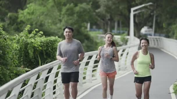 Three Young Asian People Man Woman Running Jogging Exercising Outdoor — Video Stock